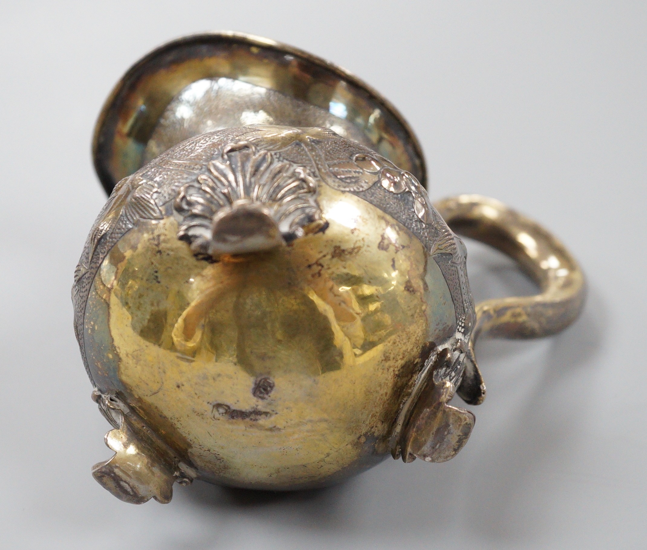 A 19th century Russian gilt white metal cream jug, indistinct marks, 94mm, 109 grams.
